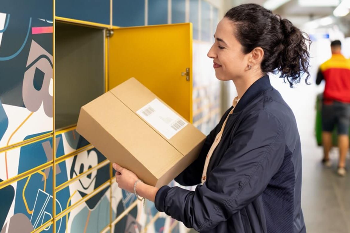 Image showing woman using parcel lockers at a train station