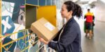 Image showing woman using parcel lockers at a train station